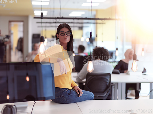 Image of business woman portrait in open space startup coworking office