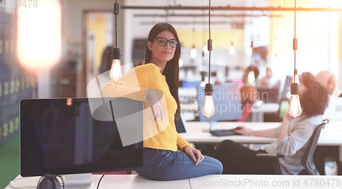 Image of business woman portrait in open space startup coworking office