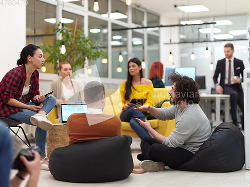 Image of team meeting and brainstorming in modern office