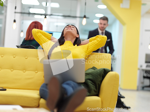 Image of at work in creative modern coworking startup open space office