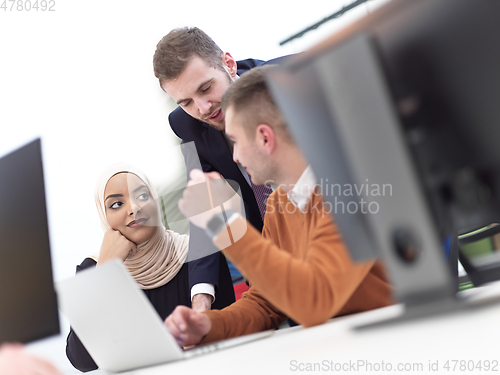 Image of creative business people group as freelancers in modern coworking open space office