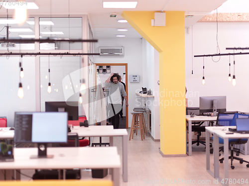 Image of creative business people group as freelancers in modern coworking open space office