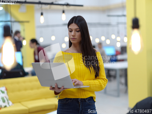 Image of young business at work in creative modern coworking startup open space office