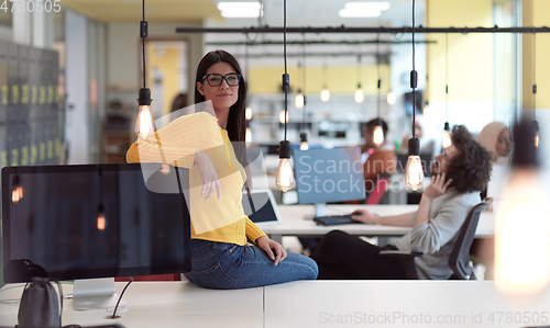 Image of business woman portrait in open space startup coworking office
