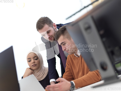 Image of creative business people group as freelancers in modern coworking open space office