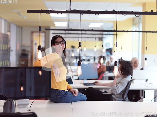 Image of business woman portrait in open space startup coworking office