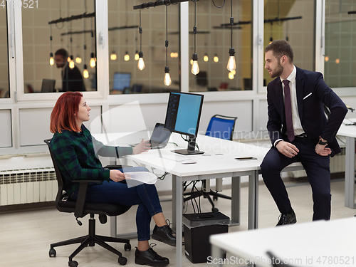 Image of business team working together on project at modern office