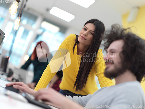 Image of creative business people group as freelancers in modern coworking open space office