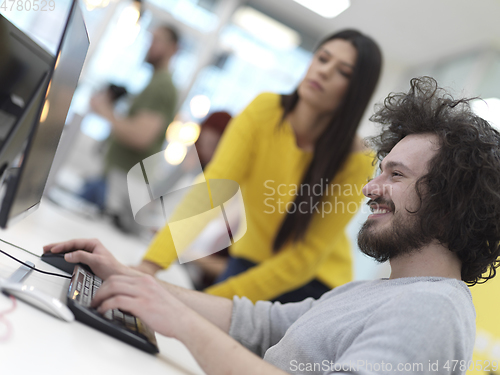 Image of creative business people group as freelancers in modern coworking open space office