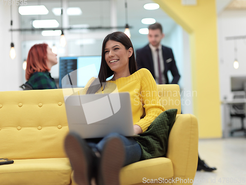 Image of at work in creative modern coworking startup open space office