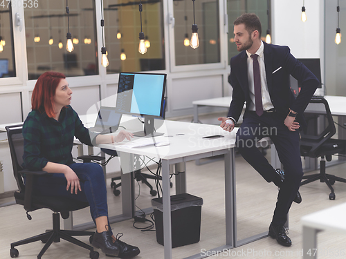 Image of business team working together on project at modern office