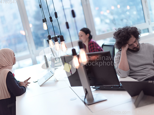 Image of business team working together on project at modern office