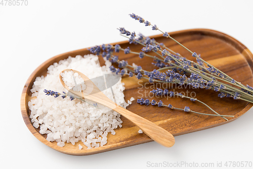 Image of sea salt heap, lavender and spoon on wooden tray