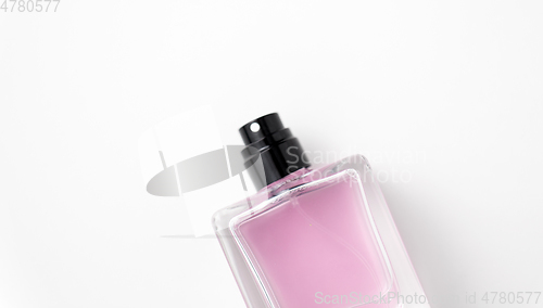 Image of bottle of perfume or pink toilette water
