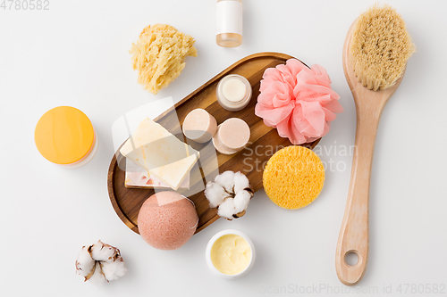 Image of crafted soap, sponges, brush and natural cosmetics