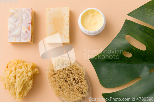 Image of natural soap, brush, sponge and body butter