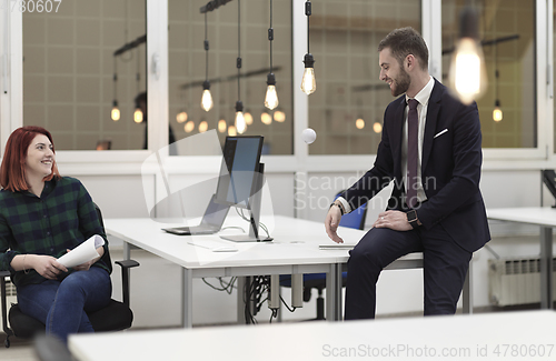 Image of business team working together on project at modern office