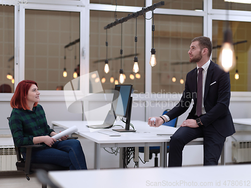 Image of business team working together on project at modern office