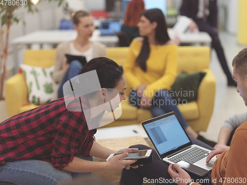 Image of team meeting and brainstorming in modern office