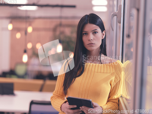 Image of business woman portrait in open space startup coworking office