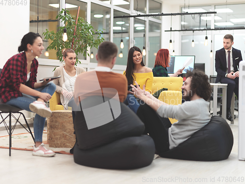 Image of team meeting and brainstorming in modern office