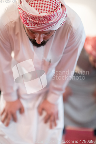 Image of group of muslim people praying namaz in mosque.