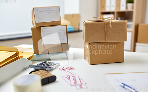 Image of parcel boxes on table at post office