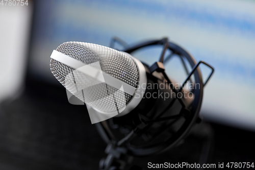 Image of close up of microphone at recording studio