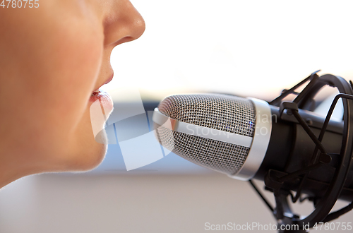 Image of close up of woman talking to microphone