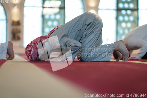 Image of group of muslim people praying namaz in mosque.