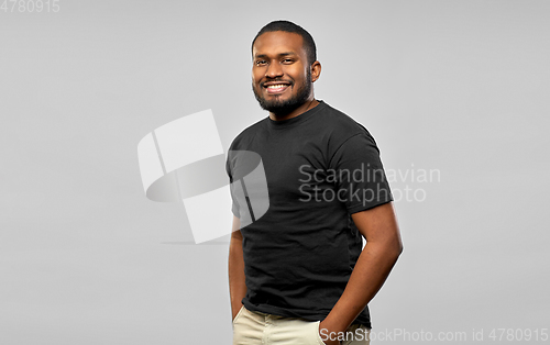 Image of smiling african american man in black t-shirt