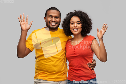 Image of happy african american couple hugging