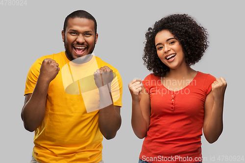 Image of happy african american couple celebrating success