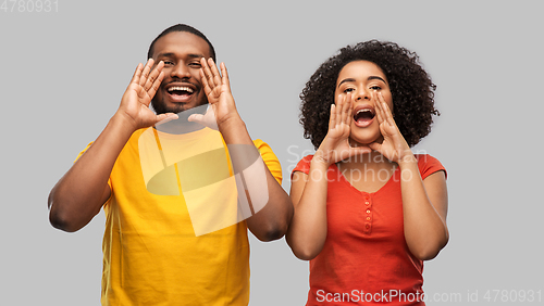 Image of happy african american couple calling