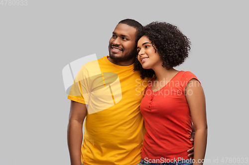 Image of happy african american couple hugging