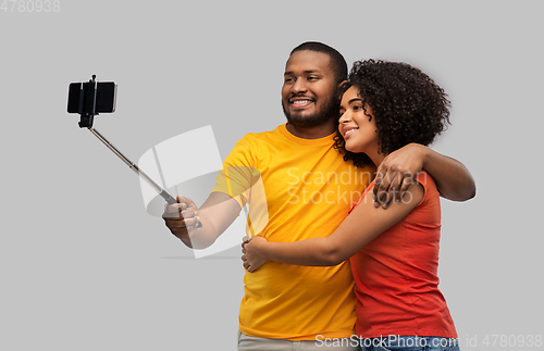 Image of african american couple taking selfie by cellphone