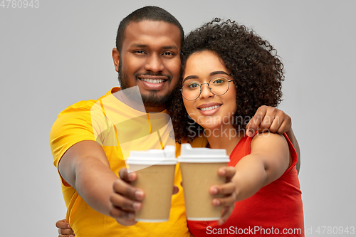 Image of happy african american couple with coffee cups