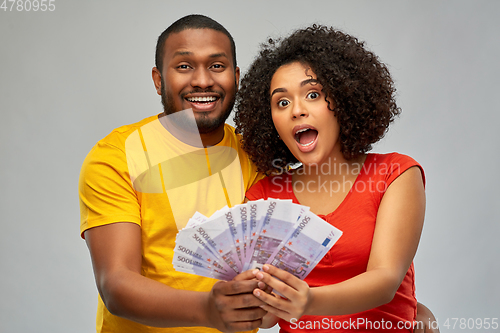 Image of happy african american couple with euro money