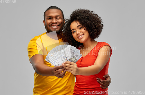 Image of happy african american couple with dollar money