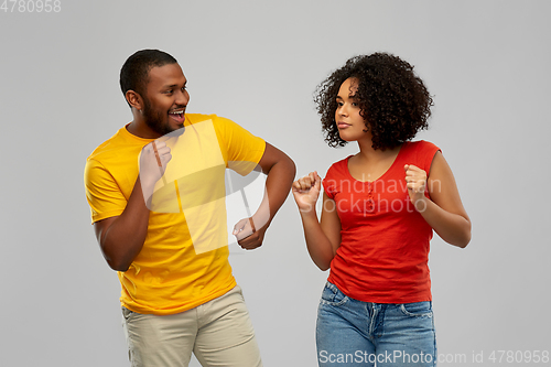 Image of happy smiling african american couple dancing