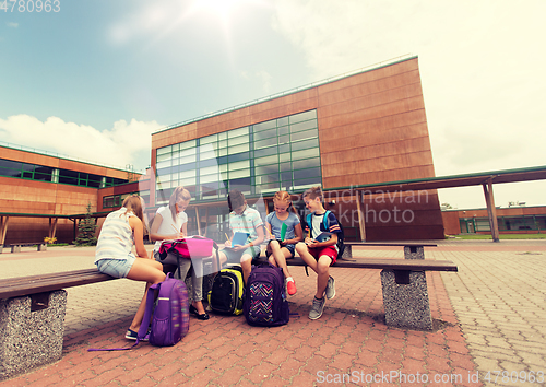 Image of group of happy elementary school students outdoors