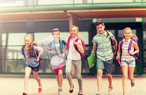 Image of group of happy elementary school students running