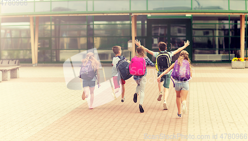 Image of group of happy elementary school students running