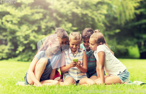 Image of kids or friends with smartphone in summer park