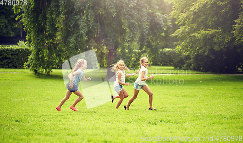 Image of happy kids running and playing game outdoors