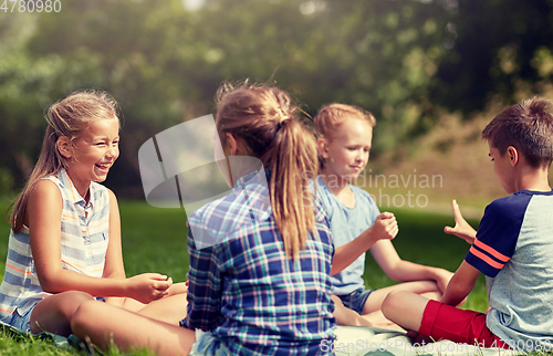 Image of happy kids playing rock-paper-scissors game