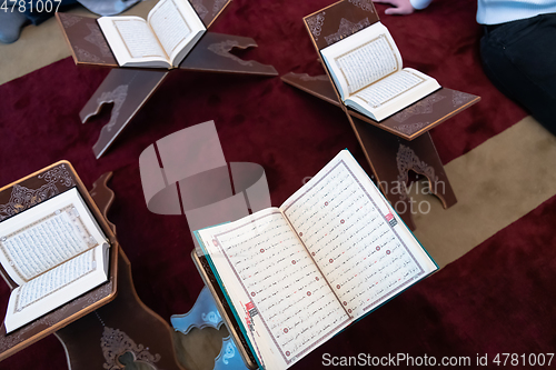 Image of The holy book of the Koran on the stand