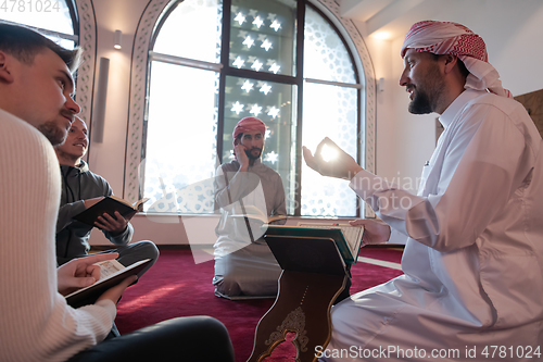 Image of muslim people in mosque reading quran together