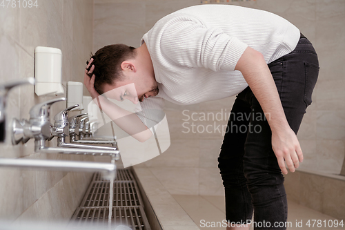 Image of A Muslim takes ablution for prayer. Islamic religious rite