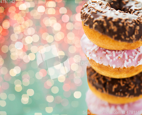 Image of close up of glazed donuts with sprinkles